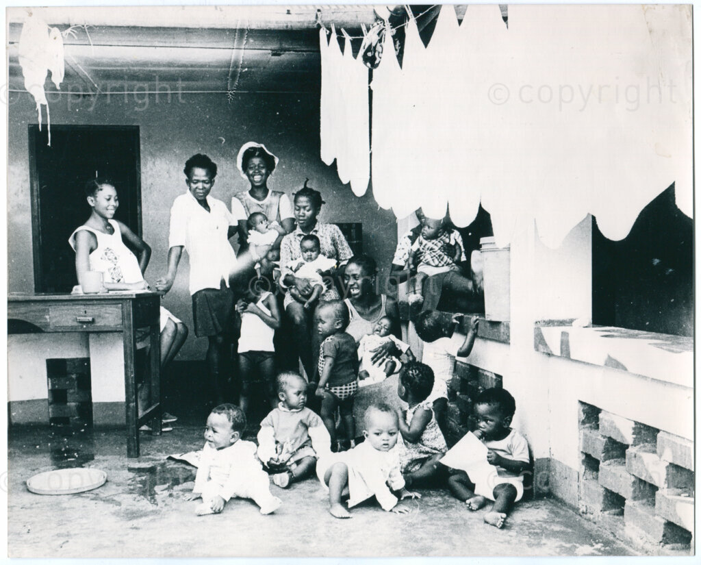 The day care centre of the ANC in Morogoro, Tanzania in 1977: group of children with their mothers/caregivers. Photographer unknown.