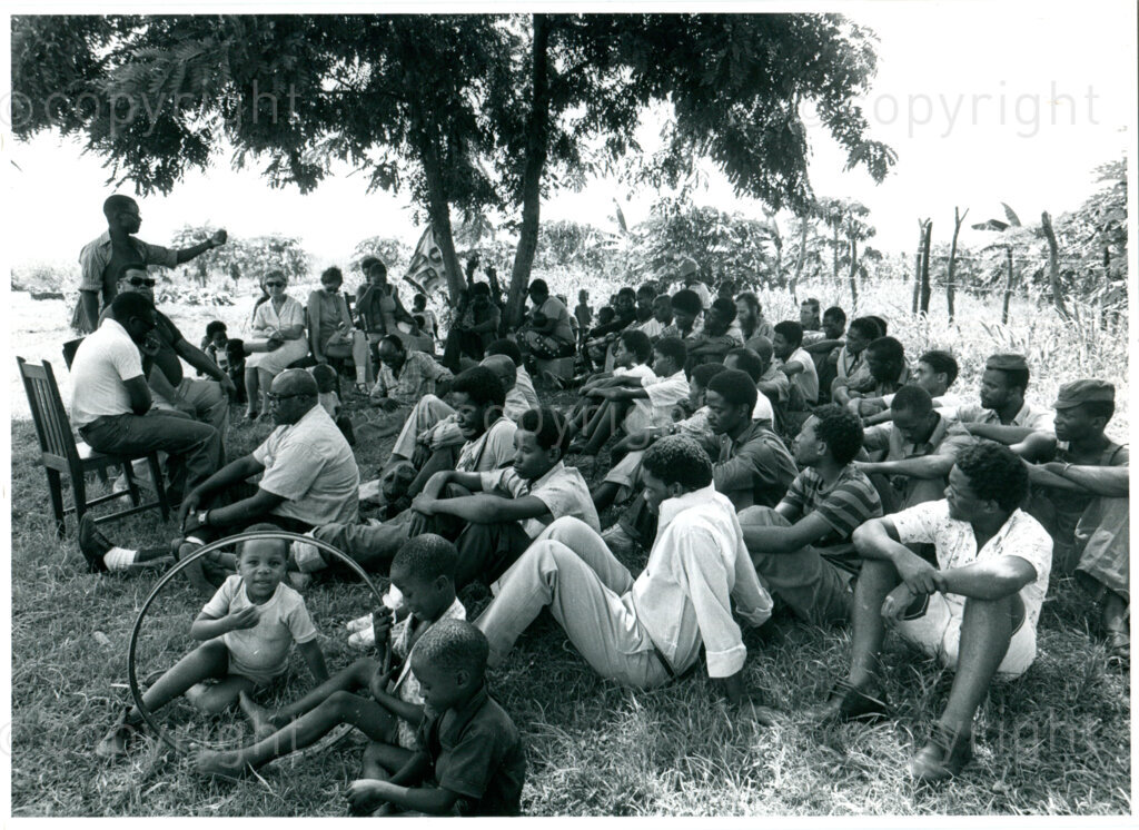 Political meeting in the early days of the ANC settlement of Mazimbu in Tanzania, 1979. Photographer: Eli Weinberg.