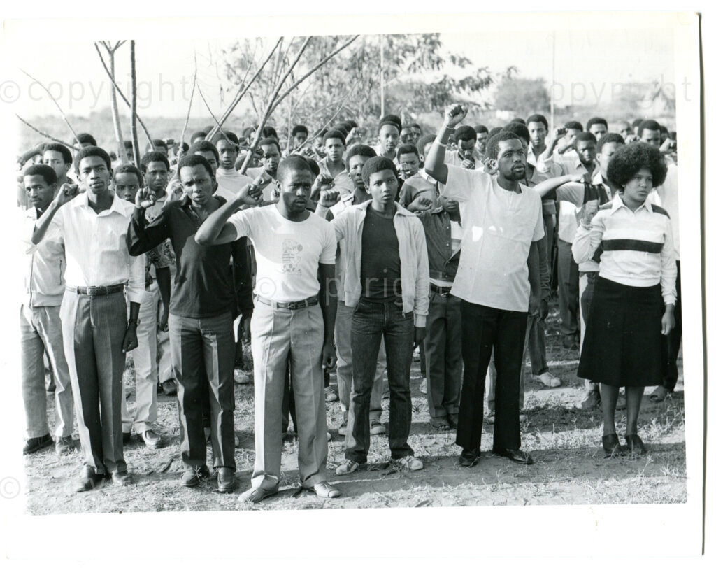 SOMAFCO Secondary school students singing the ANC's national anthem each Friday morning in Mazimbu, Tanzania, September 1983. Photo: Eli Weinberg Photo Lab.