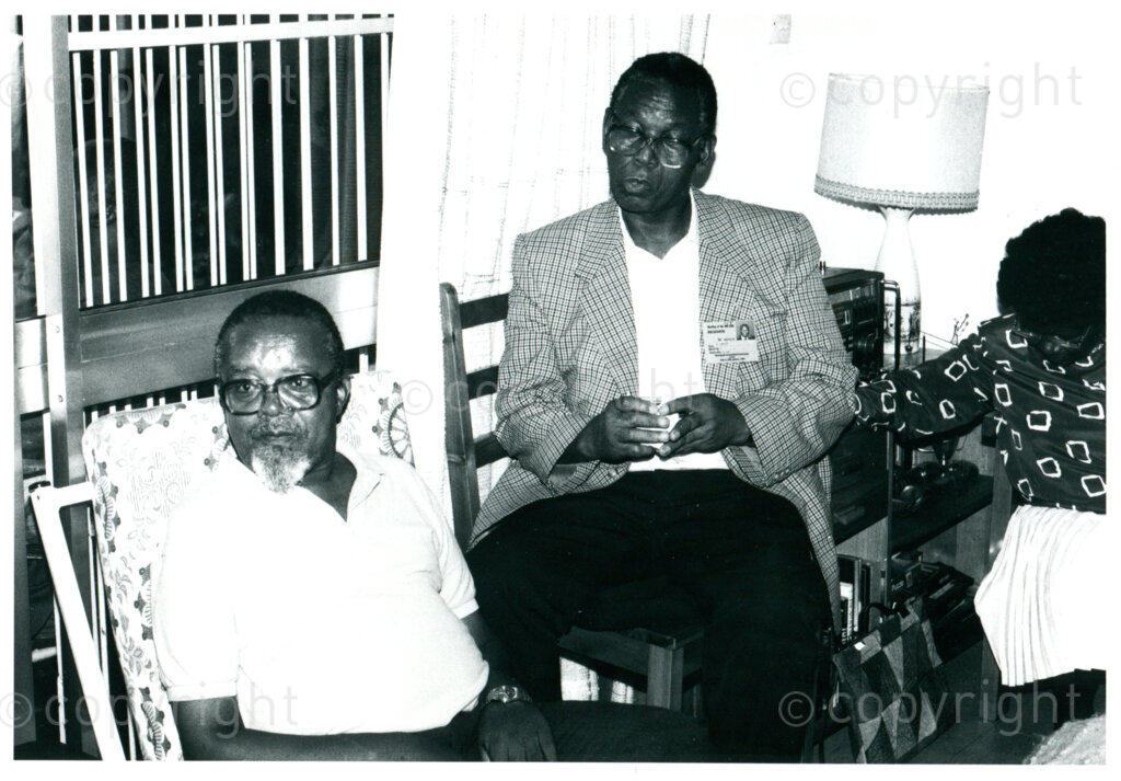 Harry Gwala (left) (ANC-activist in 1950s; Robben Island 1964-1988; ANC-leader Natal);Mazimbu, Tanzania, February 1990. Photo: Eli Weinberg Photo Lab.Right: Wilton Mkwayi (ANC-activist in 1950s; Robben Island 1964-1989; ANC Internal Leadership).