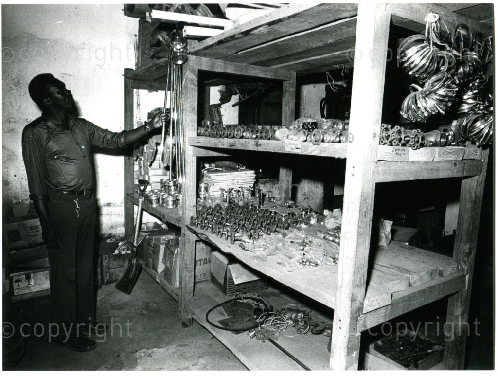 The storage department (supplies rooms), section spare parts, in Mazimbu, Tanzania, late 1980. Photo: Eli Weinberg Photo Lab.