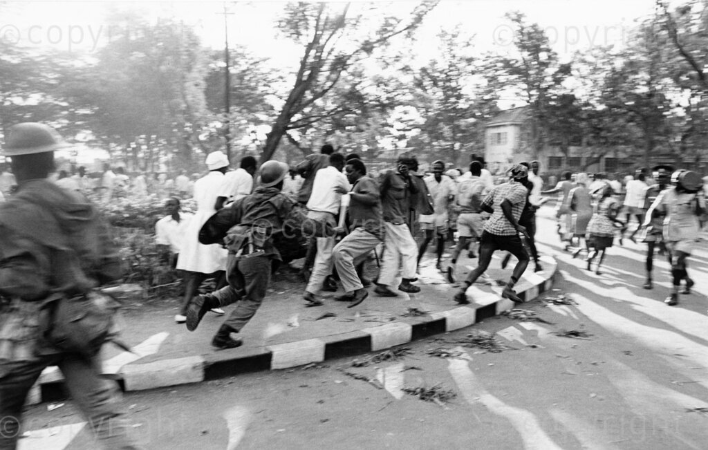 Tensions explode in Kisumu as angry crowds clash with police, who fire tear gas to disperse protesters mourning the assassination of Tom Mboya. The streets are filled with chaos as the nation grapples with the loss of one of its most prominent leader.