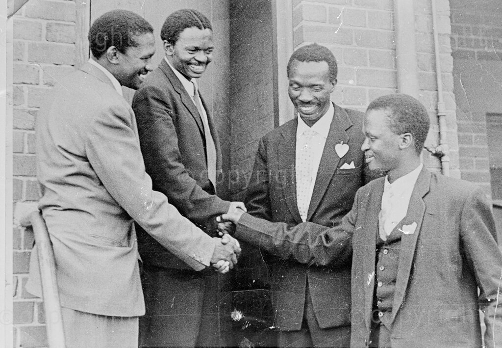 Date unknown - Robert Sobukwe (far left) shaking hands with his fellow comrades. 
Prof Sobukwe was a political dissident and freedom fighter who founded and led the Pan Africanist Congress (PAC).
Photo credit: Alf Kumalo / african.pictures