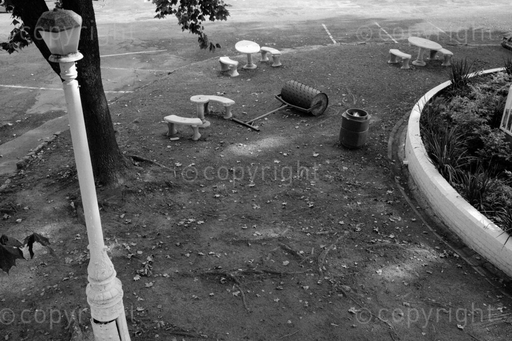 Some aspects of the city of Pietermaritzburg in KwaZulu-Natal, South Africa. Pietermaritzburg is one of the oldest cities of South Africa, the city fathers like to call it the City of Choice. The photographer John Robinson ended up back in the city when he had to leave Johannesburg while walking into the mist seeking out a dignified and beautiful place.

Pietermaritzburg is not a perfect city by any standards, it is located in a geographical bowl straddling the Msunduzi River, it is a juxtaposition of many people and things. A city that many people just pass on their way to and from the cities of Durban and Johannesburg on the bisecting N3 highway.

All these spaces are public or easily accessible to all the people of Pietermaritzburg. Though many people in this city prefer to live out their lives behind their own high walls or in office parks and malls that have visible security. Non the less these spaces remain as evidence of human intervention. 2023, Pietermaritzburg, KwaZulu-Natal, South Africa.