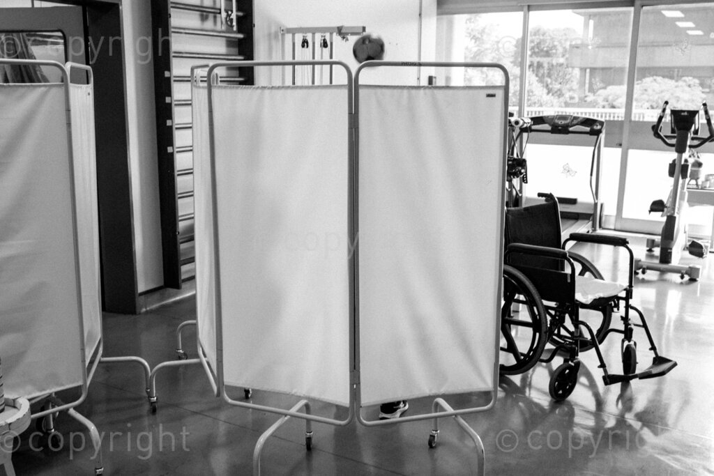 Screens preserve dignity while a physiotherapist treats a preteen after her abdominal surgery. 22, 23, Feb. 2024, Pietermaritzburg, KwaZulu Natal, South Africa.