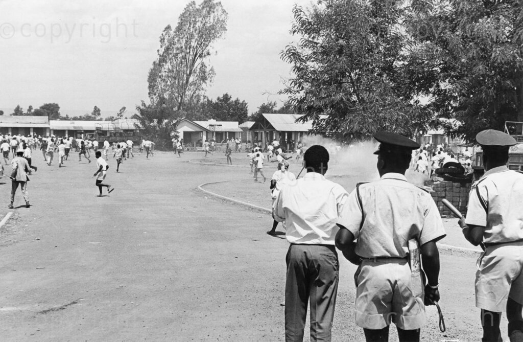 Tensions explode in Kisumu as angry crowds clash with police, who fire tear gas to disperse protesters mourning the assassination of Tom Mboya. The streets are filled with chaos as the nation grapples with the loss of one of its most prominent leader.