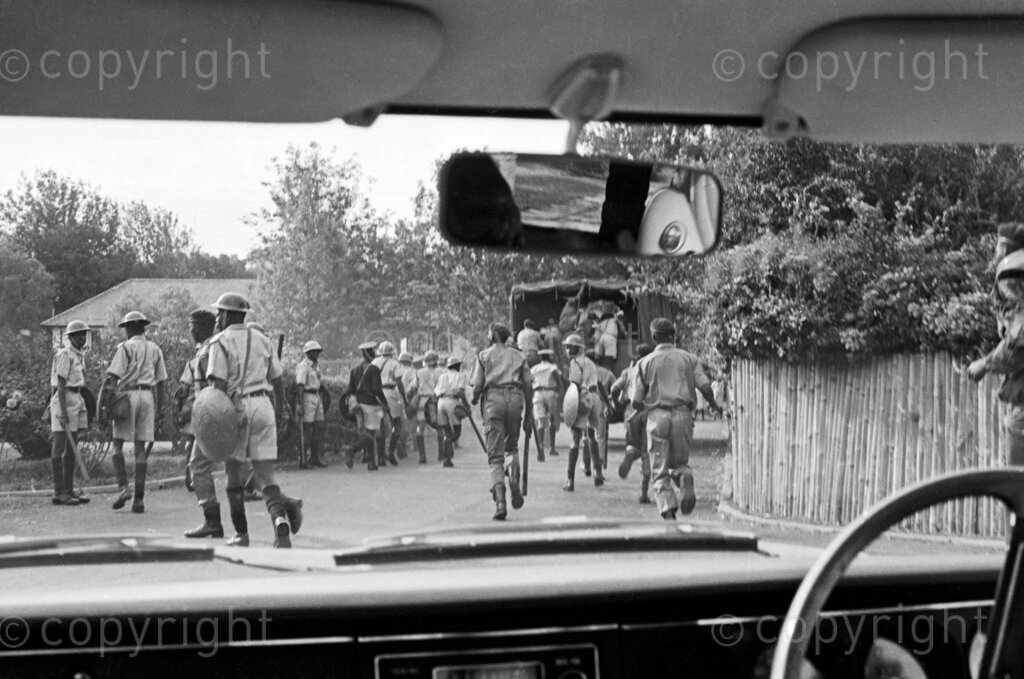Riot police clearing the way for the ambulance carrying Tom Mboya.