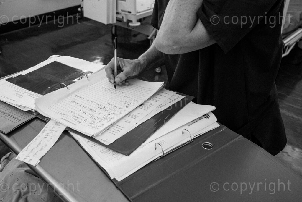 A physiotherapist writes out her treatment in a patient file, this file is a medico legal document that documents the hospital’s intervention in the patient’s healing process. 22, 23, Feb. 2024, Pietermaritzburg, KwaZulu Natal, South Africa.