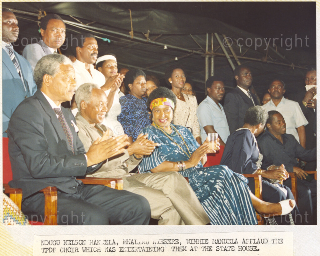 Dar Es Salaam, Tanzania. PHOTO: ANC Archives. 6 March 1990. In Dar Es Salaam, Tanzania, Deputy President of the African National Congress (ANC) Nelson Mandela (from left), Julius Nyerere, Chama Cha Mapinduzi (CCM) political party chairman, Winnie Mandela and Maria Nyerere enjoy cultural entertainment at the State House. One month after his release from prison, Mandela and his wife, Winnie, are touring African states that support the liberation struggle against apartheid in South Africa.