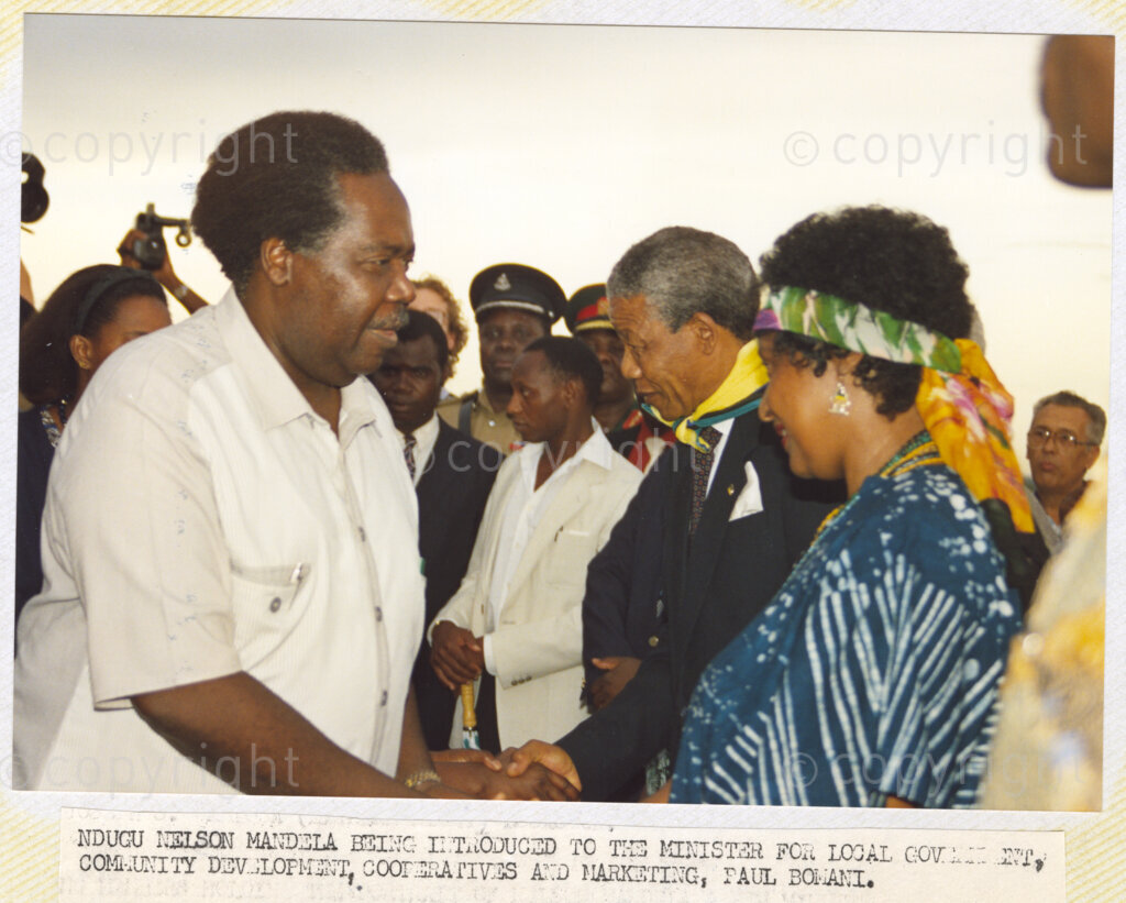 Dar Es Salaam, Tanzania. PHOTO: ANC Archives. 6 March 1990. Winnie and Nelson Mandela, deputy president of the African National Congress (ANC), (right), are being introduced to Paul Bowani, minister for local government (left), on their arrival in Dar Es Salaam, Tanzania. The Mandelas are on a tour of African states which support the liberation struggle in South Africa.