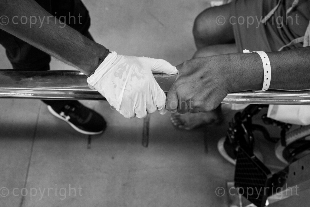 The hands of a physiotherapist and a patient meet, a lot depends on the will power of the patient in this healing process. 22, 23, Feb. 2024, Pietermaritzburg, KwaZulu Natal, South Africa.