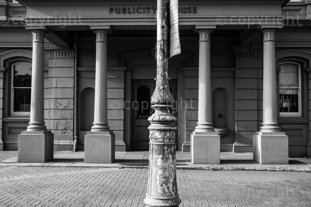 Some aspects of the city of Pietermaritzburg in KwaZulu-Natal, South Africa. Pietermaritzburg is one of the oldest cities of South Africa, the city fathers like to call it the City of Choice. The photographer John Robinson ended up back in the city when he had to leave Johannesburg while walking into the mist seeking out a dignified and beautiful place.

Pietermaritzburg is not a perfect city by any standards, it is located in a geographical bowl straddling the Msunduzi River, it is a juxtaposition of many people and things. A city that many people just pass on their way to and from the cities of Durban and Johannesburg on the bisecting N3 highway.

All these spaces are public or easily accessible to all the people of Pietermaritzburg. Though many people in this city prefer to live out their lives behind their own high walls or in office parks and malls that have visible security. Non the less these spaces remain as evidence of human intervention. 2023, Pietermaritzburg, KwaZulu-Natal, South Africa.