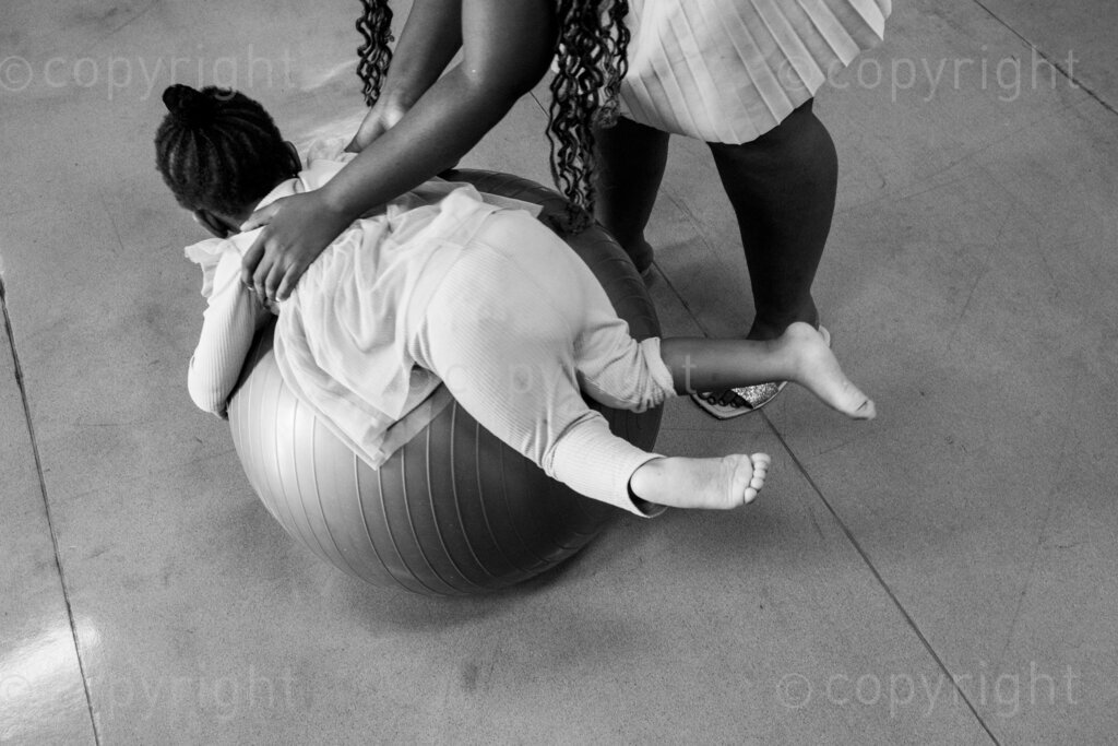 A mother and child practice the play exercises that will strengthen her child’s body. 22, 23, Feb. 2024, Pietermaritzburg, KwaZulu Natal, South Africa.