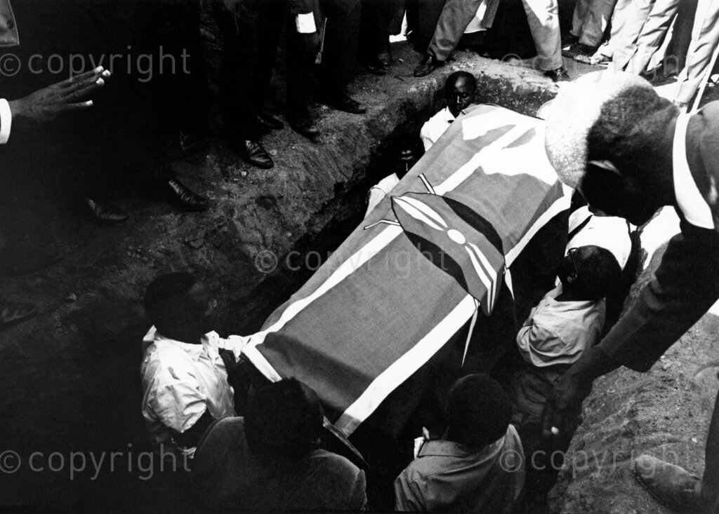 Draped in the Kenyan flag, Tom Mboya is laid to rest at Rusinga Island, honored for his dedication and service to the nation.