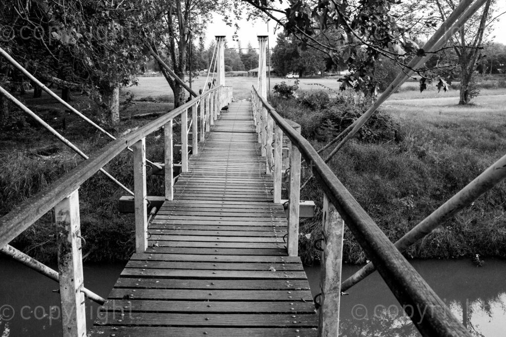Some aspects of the city of Pietermaritzburg in KwaZulu-Natal, South Africa. Pietermaritzburg is one of the oldest cities of South Africa, the city fathers like to call it the City of Choice. The photographer John Robinson ended up back in the city when he had to leave Johannesburg while walking into the mist seeking out a dignified and beautiful place.

Pietermaritzburg is not a perfect city by any standards, it is located in a geographical bowl straddling the Msunduzi River, it is a juxtaposition of many people and things. A city that many people just pass on their way to and from the cities of Durban and Johannesburg on the bisecting N3 highway.

All these spaces are public or easily accessible to all the people of Pietermaritzburg. Though many people in this city prefer to live out their lives behind their own high walls or in office parks and malls that have visible security. Non the less these spaces remain as evidence of human intervention. 2023, Pietermaritzburg, KwaZulu-Natal, South Africa.