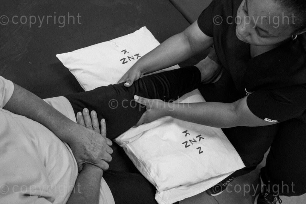 A patient sits back as her leg is massaged by a physiotherapist. 22, 23, Feb. 2024, Pietermaritzburg, KwaZulu Natal, South Africa.
