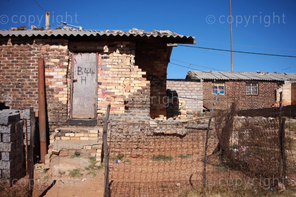 A burnt down room that used to be the public toilets at the Diepkloof hostel in Soweto, south of Johannesburg in Gauteng, South Africa. Hostel built by the apartheid government as transit camps, which offered affordable accommodation for migrant workers. Photo: Oupa Nkosi 11 July 2023 Photo: Oupa Nkosi