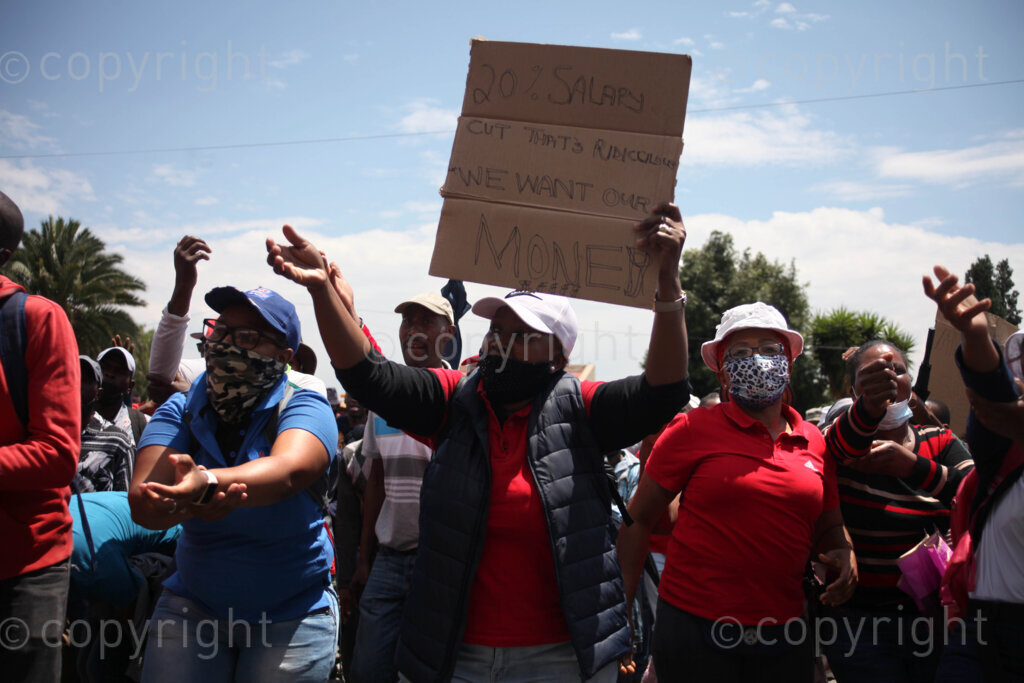 Members of Food and Allied Workers Union (FAWU) and General Industries Workers Union of South Africa (GIWUSA) together with members of civil society demonstrating at the Clover SA head offices at Constantia Kloof, Rooderkop in the east of Johannesburg, Gauteng in South Africa as the strike intensified. In 2019, Clover was bought by MILCO Consortium from Israel's top manufacturer and distributor of beverages, Central Bottling Company.  02/12/2021 Photo: Oupa Nkosi
