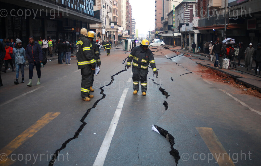 City of Johannesburg’s Emergency Management Service (EMS) employees investigating a massive explosion ripped through Lilian Ngoyi Street (previously Bree Street) on Wednesday in Johannesburg, Gauteng. 20 July 2023 Photo: Oupa Nkosi