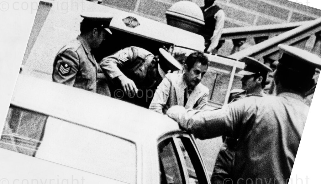 23 June 1977 - Poet Breyten Breytenbach escorted by prison warders arriving at the Pretoria Palace of justice for his trial on charges under the Terrorism Act. 
Photo credit: Arena Holdings / african.pictures