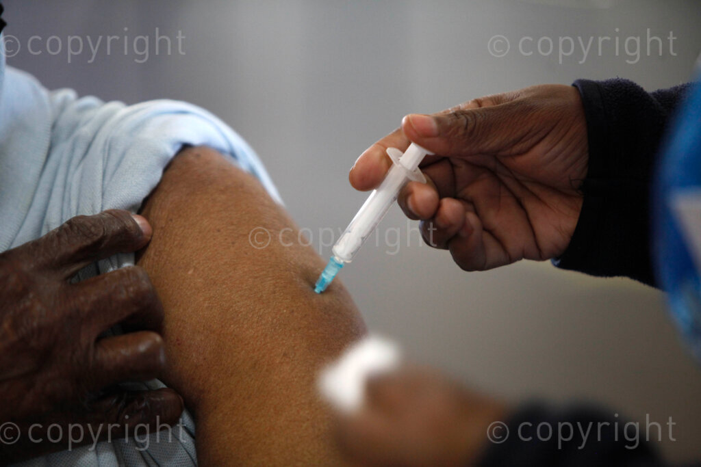 An elderly woman getting a Pfizer Covid-19 vaccines that is reserved for teachers at the Sports Centre in Naledi Extension  2 in Soweto, south west of Johannesburg in Gauteng, South Africa. 24/06/21 Photo: Oupa Nkosi