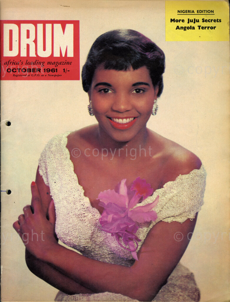 More Juju Secrets; Angola Terror; Verso: The Cover girl: an orchid for the lady in figure-hugging dress and what a glamorous final touch a flower can give to a woman. The dress might not be quite the thing for these chilly days, but for sure to warm your heart.