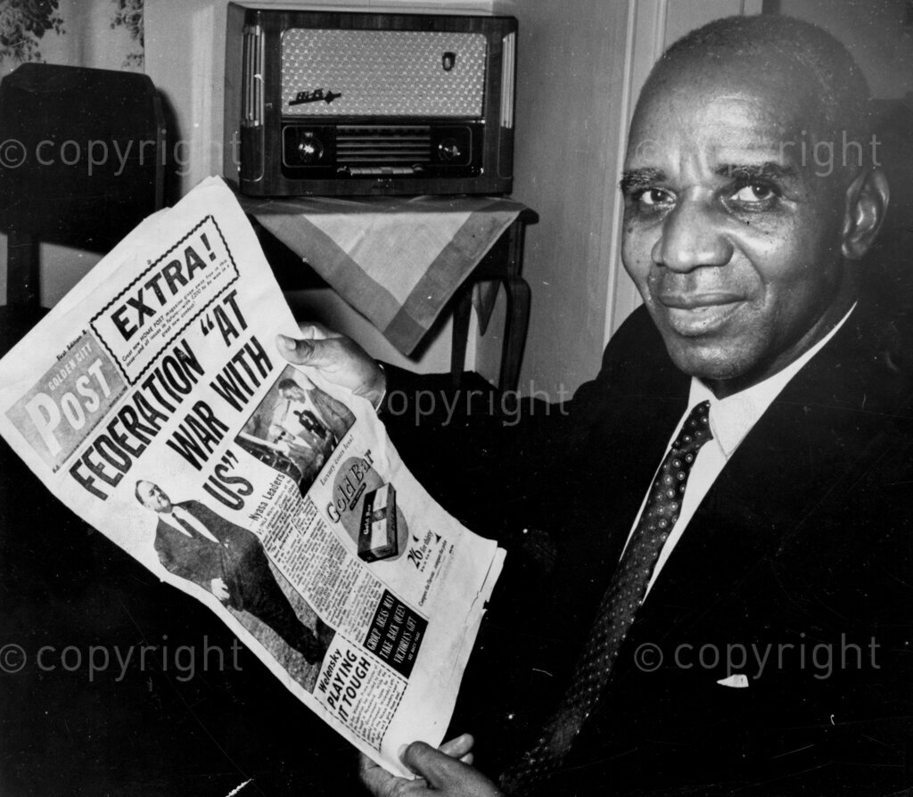 Dr Hastings Banda, reading a newspaper.