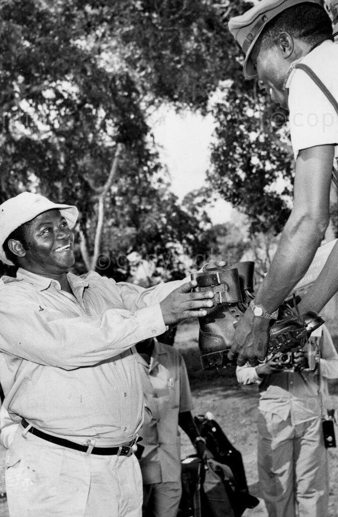 TANU rally – Second Vice President Kawawa receiving his shoes.