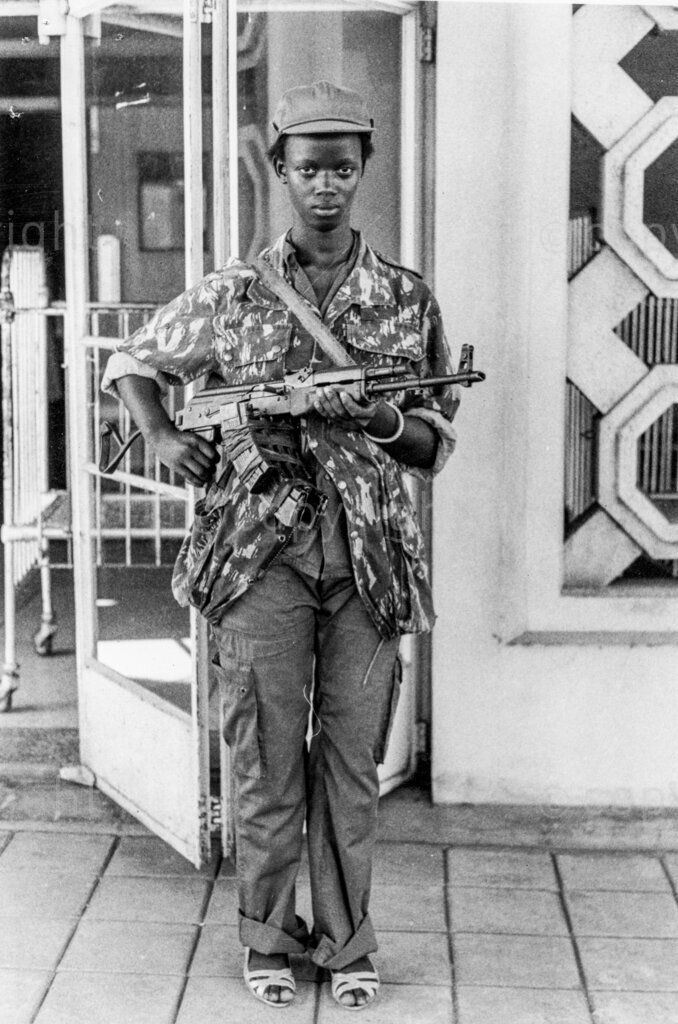 Edith, 15, is one of the female soldiers on guard at Mulago Hospital. She grew up in the bush under the care of the NRA guerillas. During the liberation war, she shot down one helicopter and rounded two lorries carrying Okello's men.