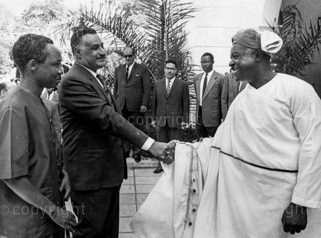 President Gamal Abdel Nasser of Egypt visits Tanzania. President Nasser being welcomed to Parliament building by the speaker of the Tanzania National Assembly Chief Adam Sapi Mkwawa, President Julius Nyerere on the left next to Nasser.