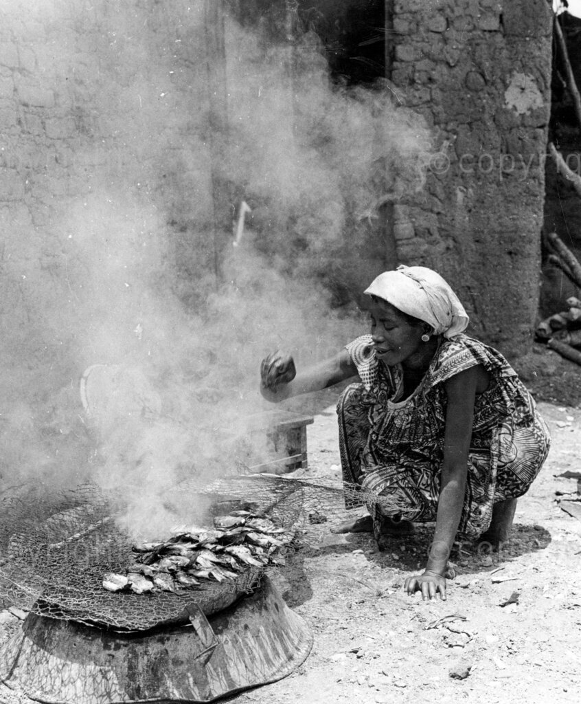 Ghana's Mystery Lake – Preparing fish for market. Some of the women in area make a living by selling smoked fish to markets beyond. Lake Bosumtwi is about 20 miles South east of Kumasi, is one of Ghana's big natural attractions. But that is not all. It is also the spiritual centre of the local people, and is associated with numerous taboos.