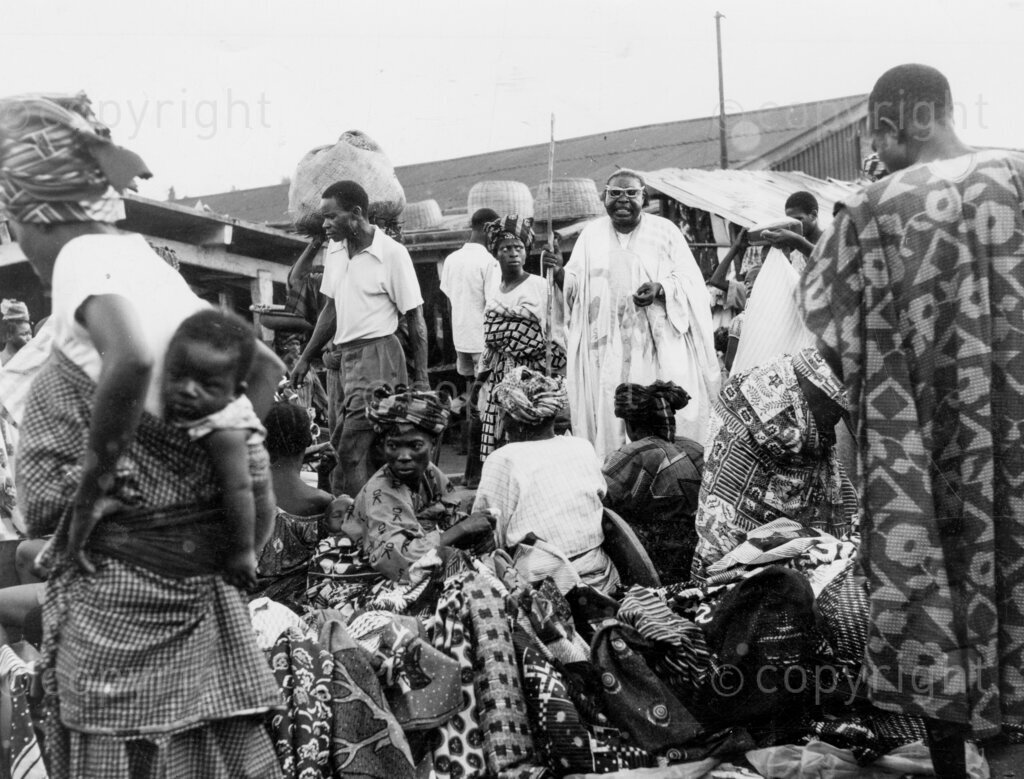 The beggar is a gentleman – Mallam Idris on his begging round. Mallam Garudi Idris has made begging a gentlemanly vocation. For over 50 years he has contradicted the popular belief that beggars can't be choosers. For Mallam Idris has chosen well: at one time 10 wives, all of whom he kept in comfort. Since he was two years old, Mallam now 55, has been a beggar – a gentleman beggar. He does not beg because he is blind or because he has been afflicted with any crippling disease. Mallam Idris begs for alms because his father was before him was a beggar and because he believes that he was born a beggar. Mallam is employed by the Federal Government as a messenger in one of the Ministries.