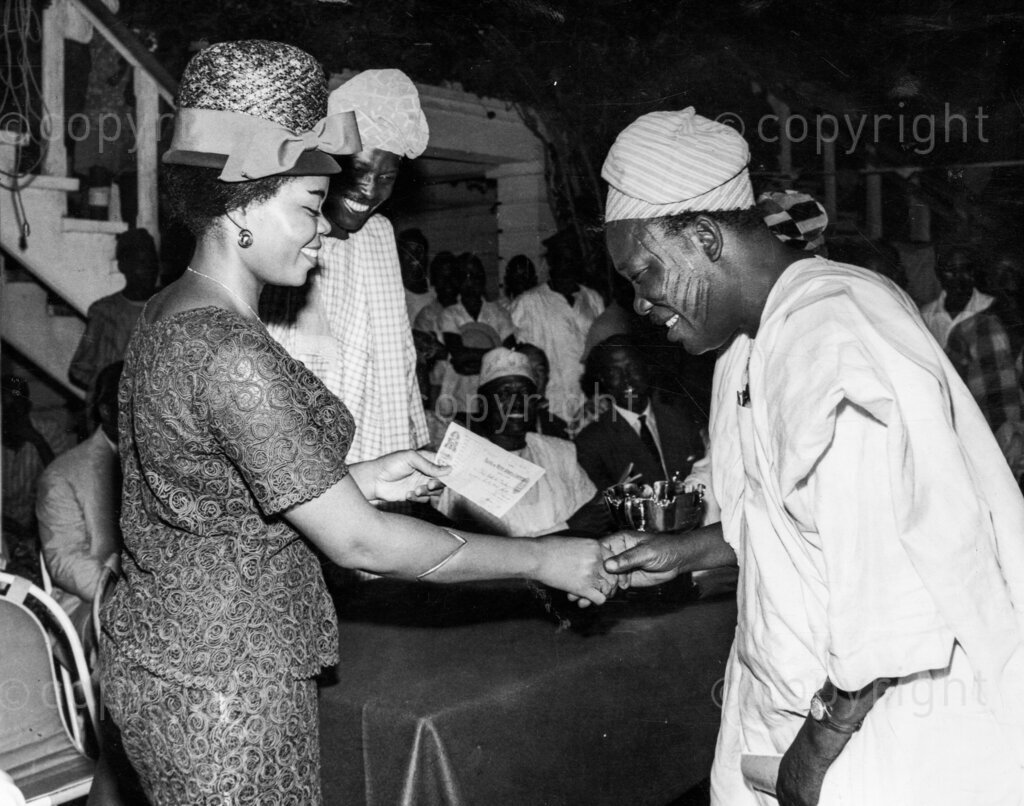 The beauty and Mr Benson. Mrs Benson goes to races with husband. Since she came to live in Lagos, Mrs Opral Benson has won everyone's heart and is now the most talked about Minister's wife in Nigeria. Opral has almost caught more limelight than her husband, Mr Theophilous Owolabi Shobowale Benson, Federal Minister of Information.