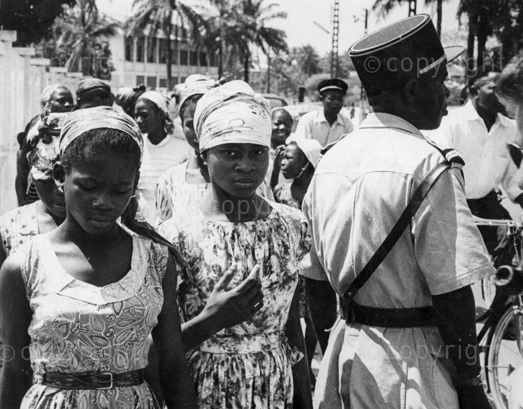 Terror in the Cameroons. Search for weapons, they are only young girls, but they have been under cover agents for the outlaws. The security force men stop them and search for hidden arms. The outlaws have a tremendous advantage over the police because the police do not know who the outlaws are, while the outlaws know very well who they are fighting.
