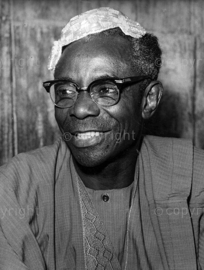 The Exile and return of the Olu of Warri. Now the ex-king just sits and waits. In 1964, his highness Ere juwa II was deposed as the Olu of Warri and exiled to the lack-lustre village of Ogbesse where, for sixteen months, he learned to wait and live with his fate.
