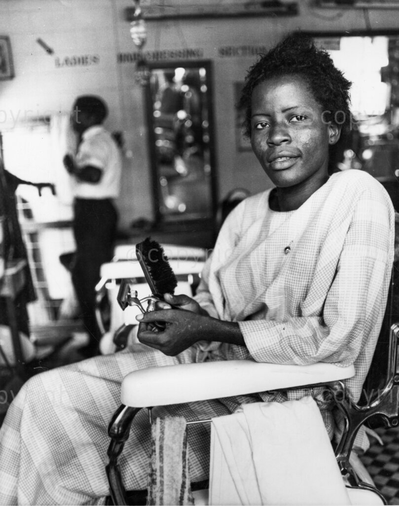 Nigerian women barbers.