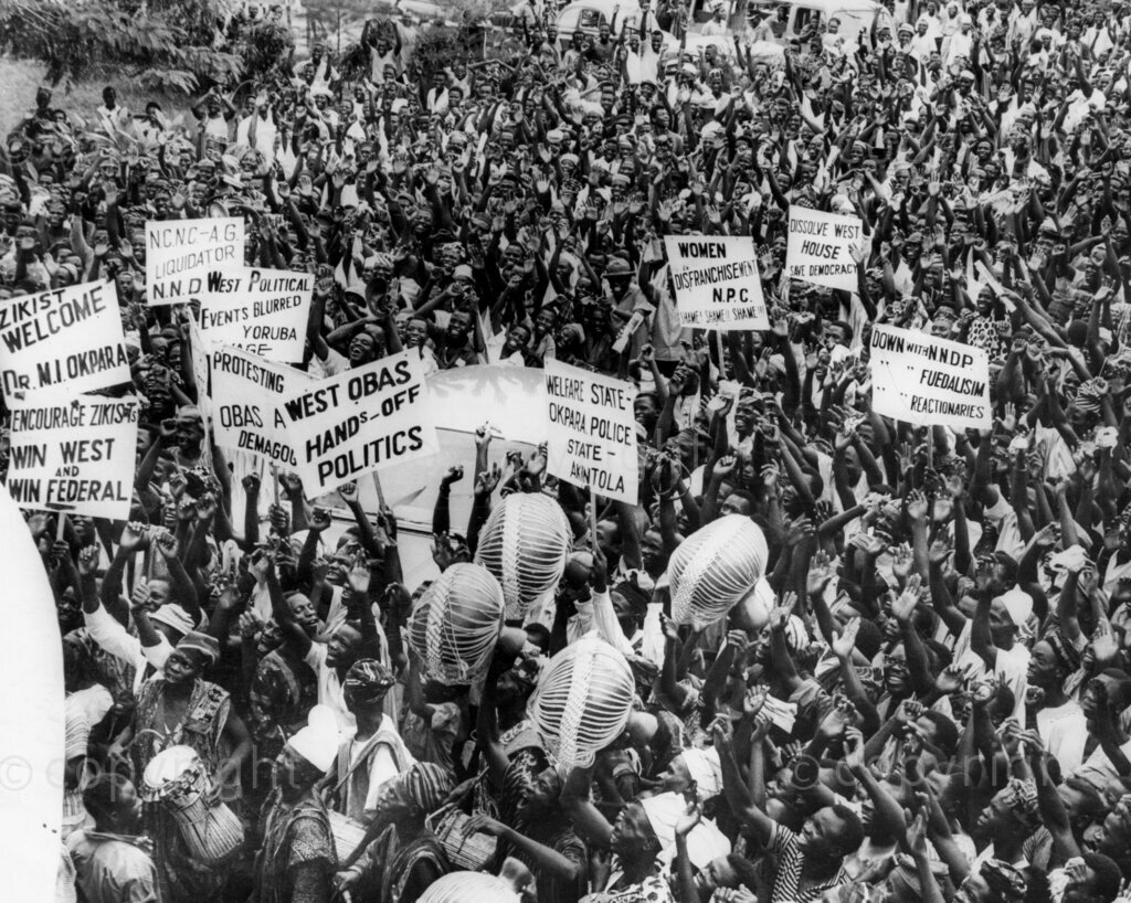 Despite the fear and the threats, Okpara triumphs In No-Man's Land. Okpara snaps the huge crowds. Dr Michael Okpara's meet-the-people-tour of Western Nigeria, apart from proving a bizarre mixture of incivility, escapism, hefty defence against non-existent troubles and a field day for journalistic zanies and radio cranks, was a glorious personal triumph for Dr Okpara's bravery and a confirmation that the people of Western Nigeria have not forgotten Chief Abafemi Awolowo and can still welcome any leader who comes along as his friend.