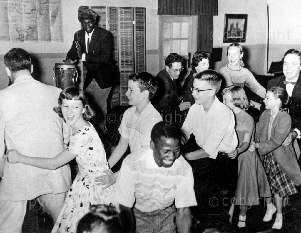Here's Nigeria's greatest showman; Anyaogu Elekwachi Ukonu, Nigeria's actor. This is Ukonu diverting his audience with his African drumming. He can make you laugh yourself sick and he can also make you feel sweetly sorrowful. His ambition, he says, is to make people forget their problems and blues. Anyaogu Elekwashi Ukonu is an uninhibited showman. You never can tell what he will be up to next.