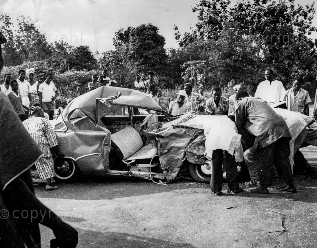 Nigeria Road Accident, another scene of a car crash. People help to clear the wreckage.