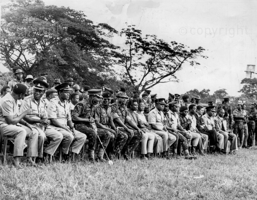 Two officers executed in the tragedy of war. Army and police officers brought their wives to see the shooting. It was Thursday, June 27. The radio made frequent announcements that two unnamed officers of the Nigerian army were to face a firing squad at King's Square, Benin City that day for 