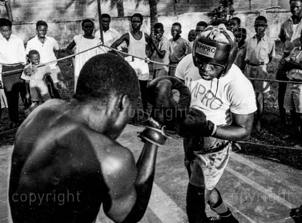 Martin Santos Nigeria's welterweight, Martin (right) training for a fight under poor backyard conditions in the sun.
