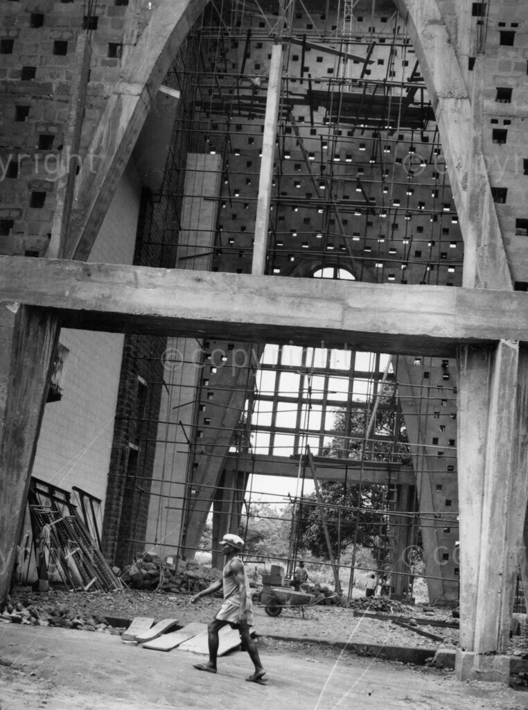 Will we ever see this finished? The Builder; one of the architects who says the cathedral may take 60 years to finish. Thirteen years ago the foundation stone for All Saints Cathedral was laid. Today partially completed wing dominates Onitsha in Eastern Nigeria.