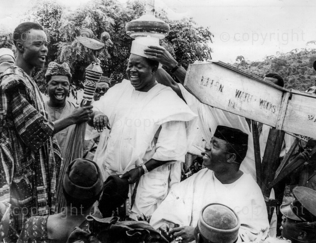 Despite the fear and the threats, Okpara triumphs In No-Man's Land. Okpara receives chieftaincy cap at Ijebu-Ode. Dr Michael Okpara's meet-the-people-tour of Western Nigeria, apart from proving a bizarre mixture of incivility, escapism, hefty defence against non-existent troubles and a field day for journalistic zanies and radio cranks, was a glorious personal triumph for Dr Okpara's bravery and a confirmation that the people of Western Nigeria have not forgotten Chief Abafemi Awolowo and can still welcome any leader who comes along as his friend.