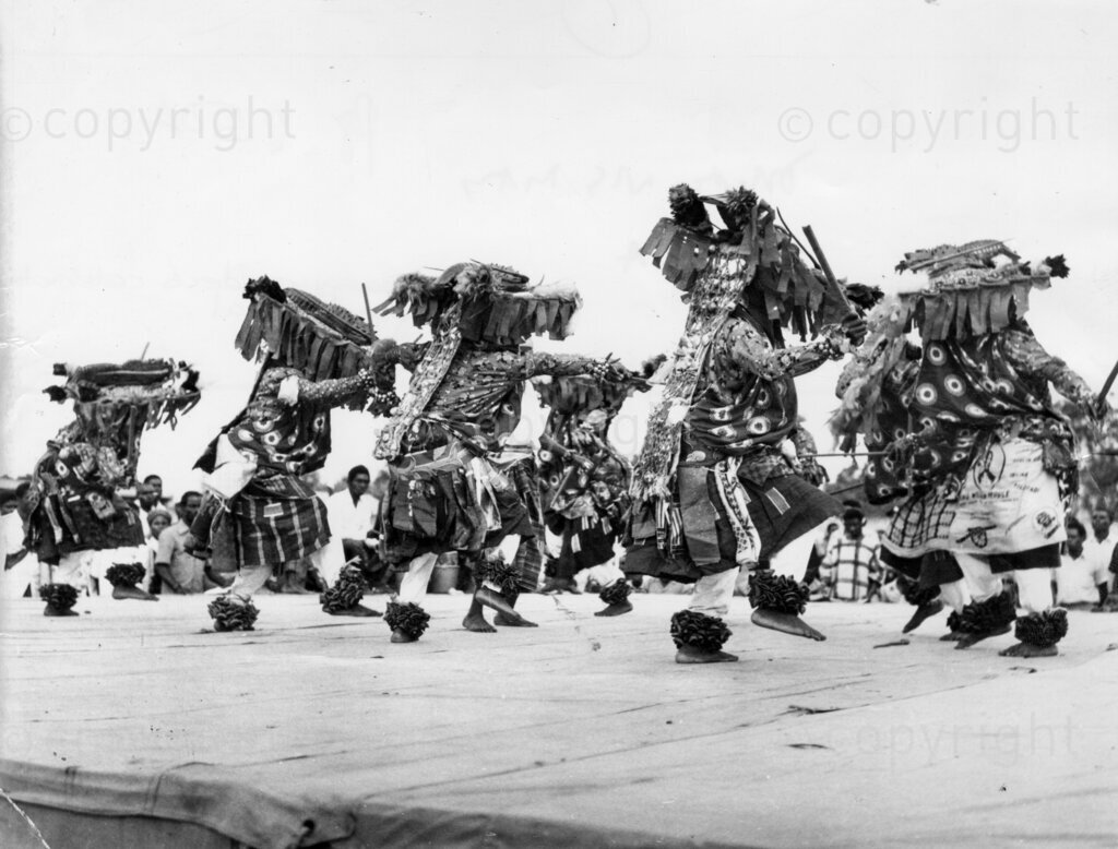 Dancing masquerades celebrate the Egungun Festival.