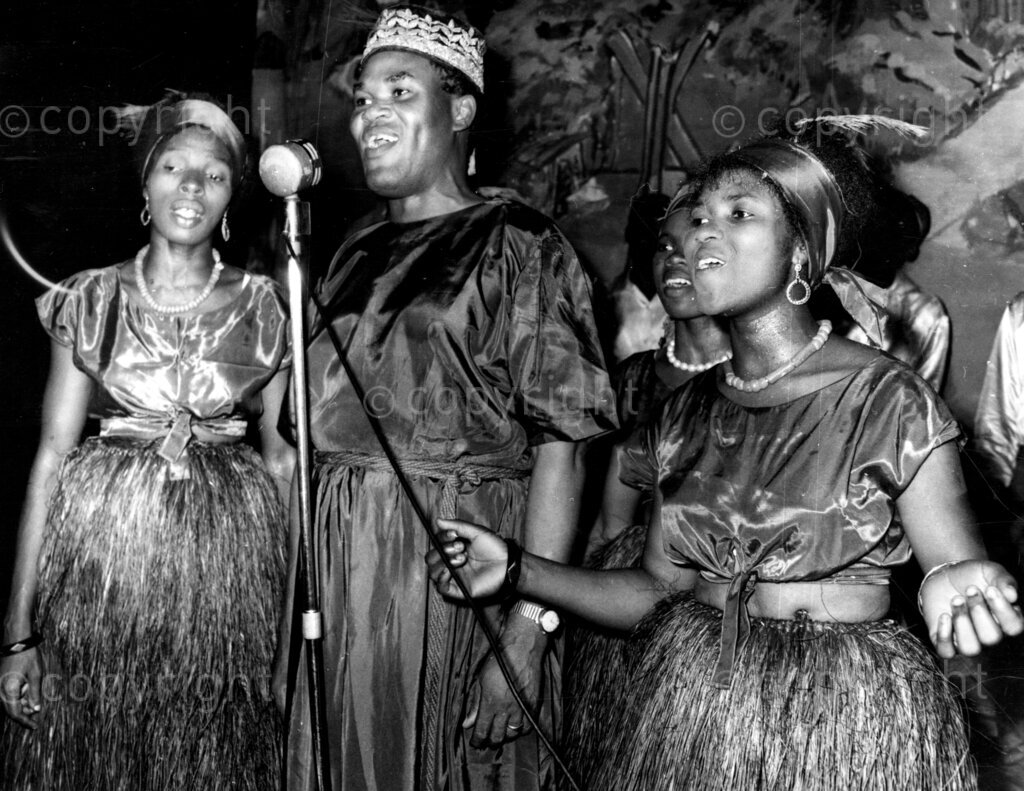 Nigerian showman and wives; Ogunde Mr Hubert. Before Ogunde starts his real plays, he entertains his audiences to dances and acrobatic displays featuring his wives and actors.