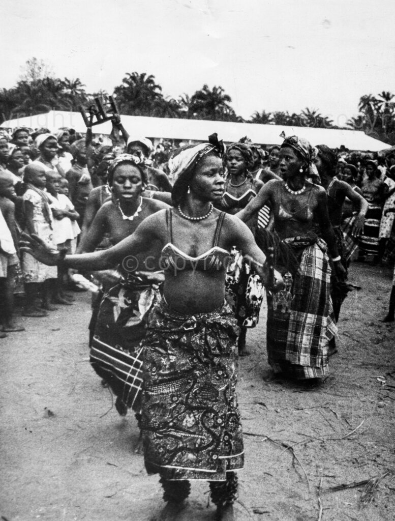 A song and dance for rain. The dance goes on for more than five fours. Some of the women are in a trance by the time it is over. But still they keep on singing, beating the ground and praying.