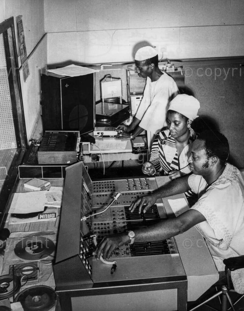 Music From Stones. Phonogram's recording studio at Ijora where Onibonokuta was rehearsing for his first record. Two technical officers can be seen on either side of Mrs Keji Okunowo, the company's Creative Manager.