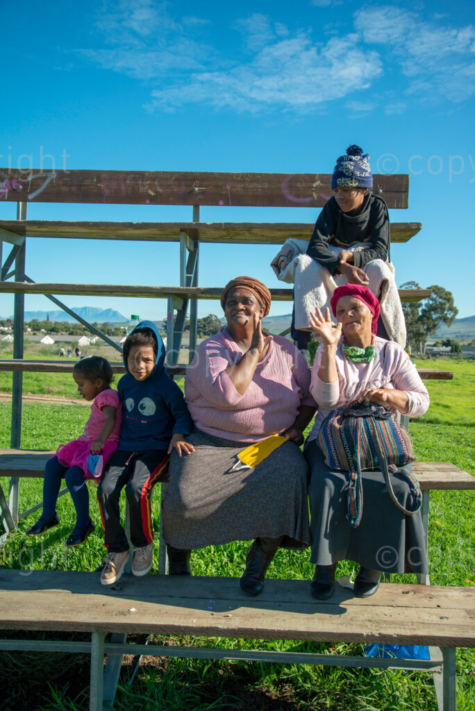 Friends (L to R) Anelda Williams, 49, and Dora Alexander, 59, (right) with their children Marlin and grandchildren, in Jamestown, Stellenbosch, on Tuesday, June 16, 2020. 
“I was a house keeper for three days,” says Alexender. “There is no job now because of lockdown. Because there is children in the house (where I was working).” 
“I’m waiting for the R350. SASSA (South African Social Security Agency) promised when you sit at home, when there is no work because of lockdown, for six months, you get the R350,” she says. 
“I’m still waiting for that. I sent my son to the bank. There is nothing in the bank,” she says. “I applied for it about three weeks ago. I think I must wait and see until the end of the month.” PHOTO: EVA-LOTTA JANSSON 













