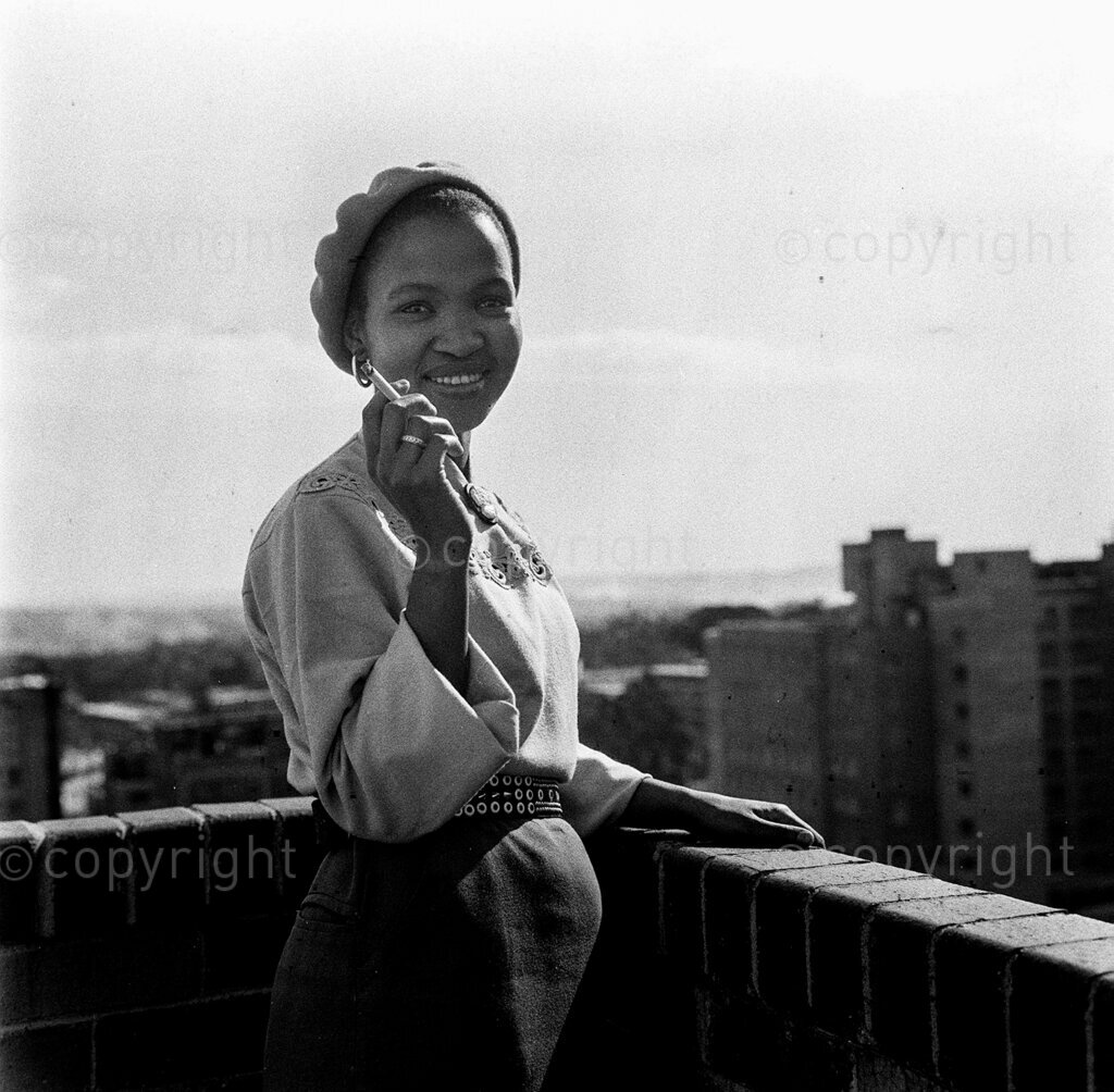 What About Us Asked The 'Flat Girls' – Elsie Kgabutlweli came to Jo'burg from out in the Free State. It didn't take long to learn city ways of dress. It didn't take long to either to acquire the trade of smoking without offending. The girls who work in the flats have taken up the challenge. They just don't like the way the factory workers claimed in last month's Drum that they were the smartest cuties that ever made folk stare.