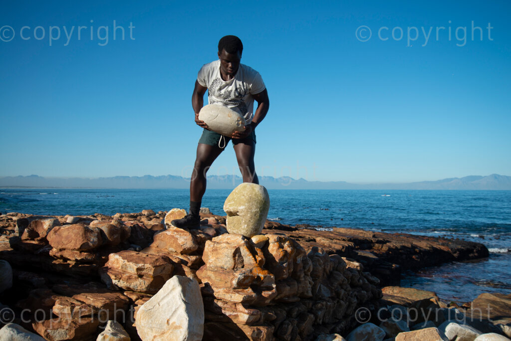 Sipho Njengezi balances rocks in Kalk Bay, Cape Town, on Thursday afternoon, July 17, 2020. PHOTO: EVA-LOTTA JANSSON 